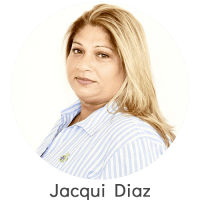 Middle-aged woman with light brown hair in a blue striped shirt.